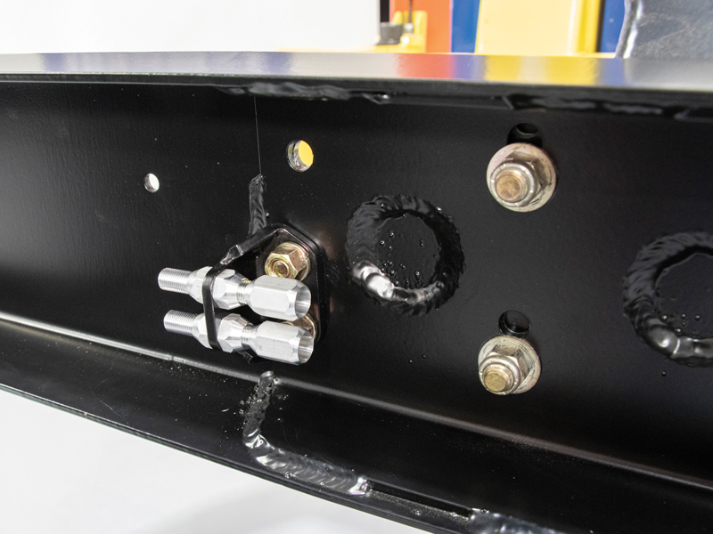  Next, he bolted the CPP dual cable adjuster bracket to the frame using one existing hole, then drilled a new hole for the second bolt. Then Scudellari installed the cable adjuster bulkhead fittings to the bracket.