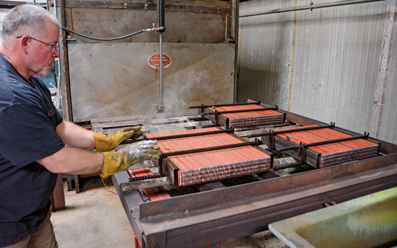 Several cores are ready to go into the oven. This melts the solder that is coated on the tubes and creates a strong bond with the fins.