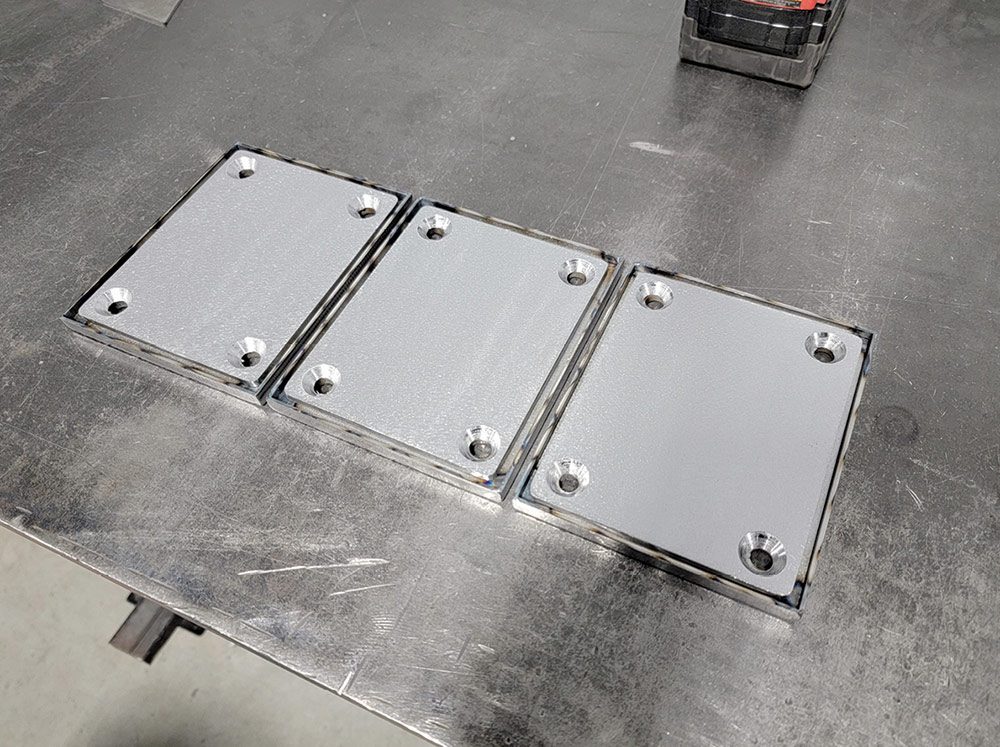Sideboard mount plate brackets on workbench