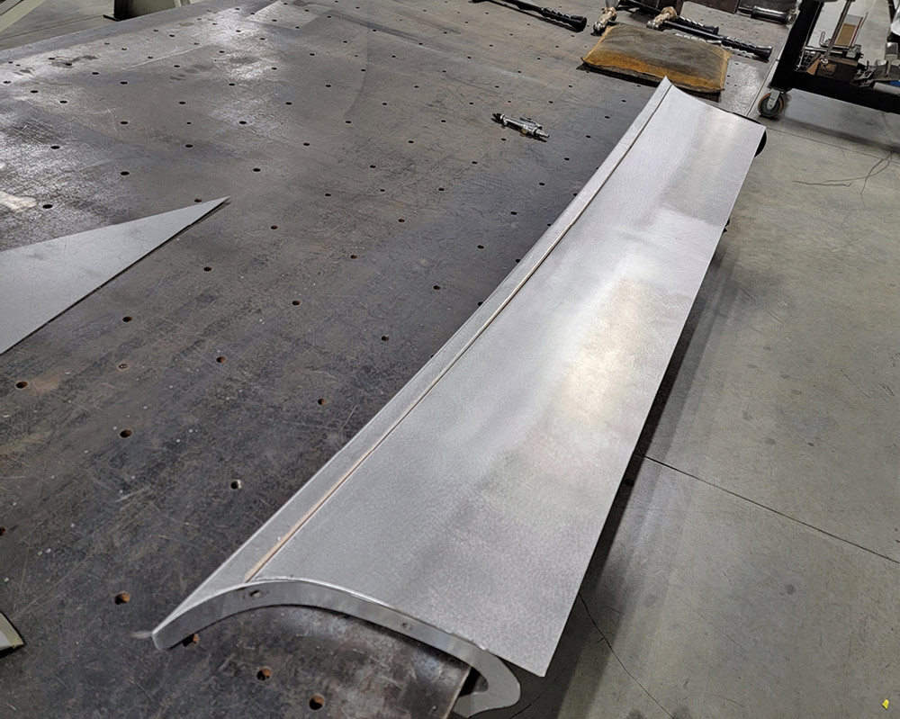 Secondary metal skin covering welds