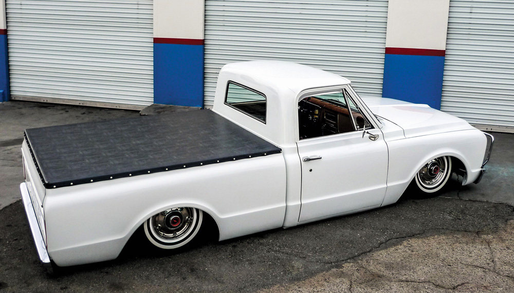 rear side angle view of white chevy truck