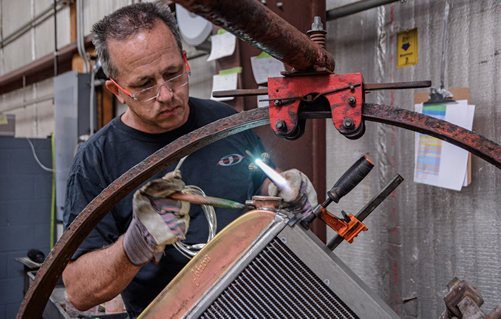 Builder working on a radiator