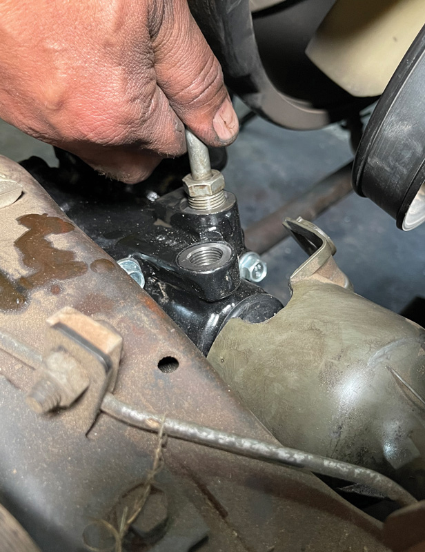 Make sure the O-ring seals are installed and in good condition before connecting the fluid lines. The lines have different size fittings, but for the record, the low-pressure line is closest to the input shaft and the high pressure is closer to the four-bolt cover. (In this picture, we’re connecting the high-pressure line.)