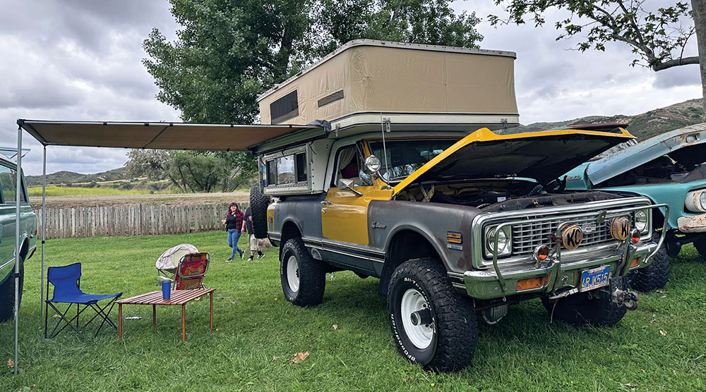 Lifted yellow K/5 Blazer with unpainted body panels and vintage camper cap