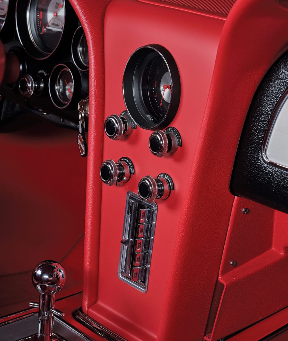 close up of red dashboard in a '57 Chevy
