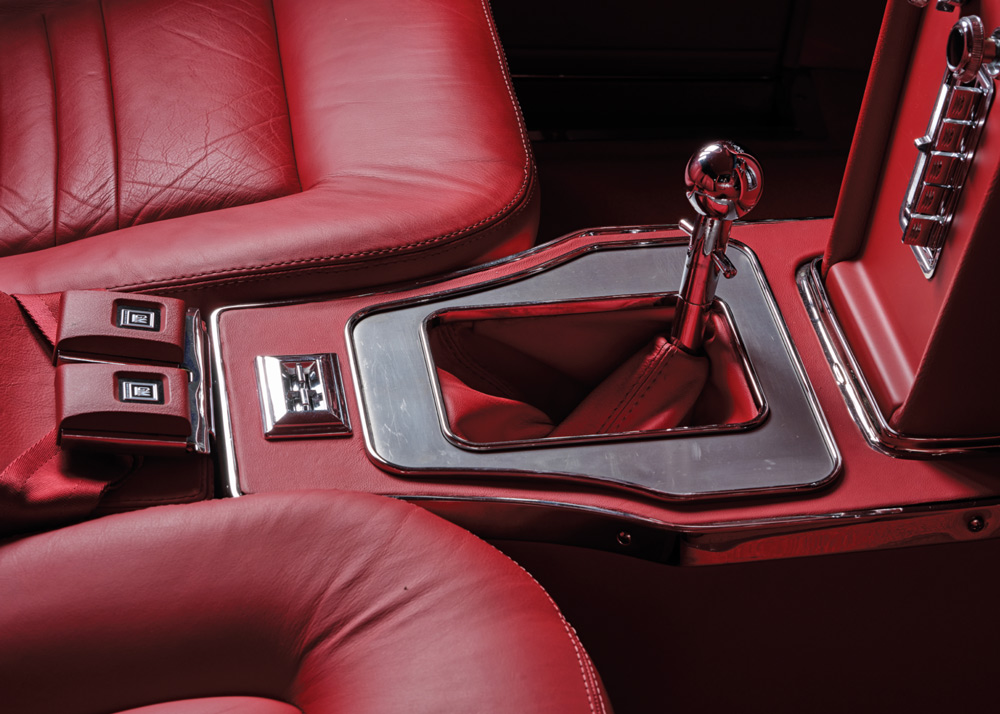 red leather interior and shifter in a '57 Chevy