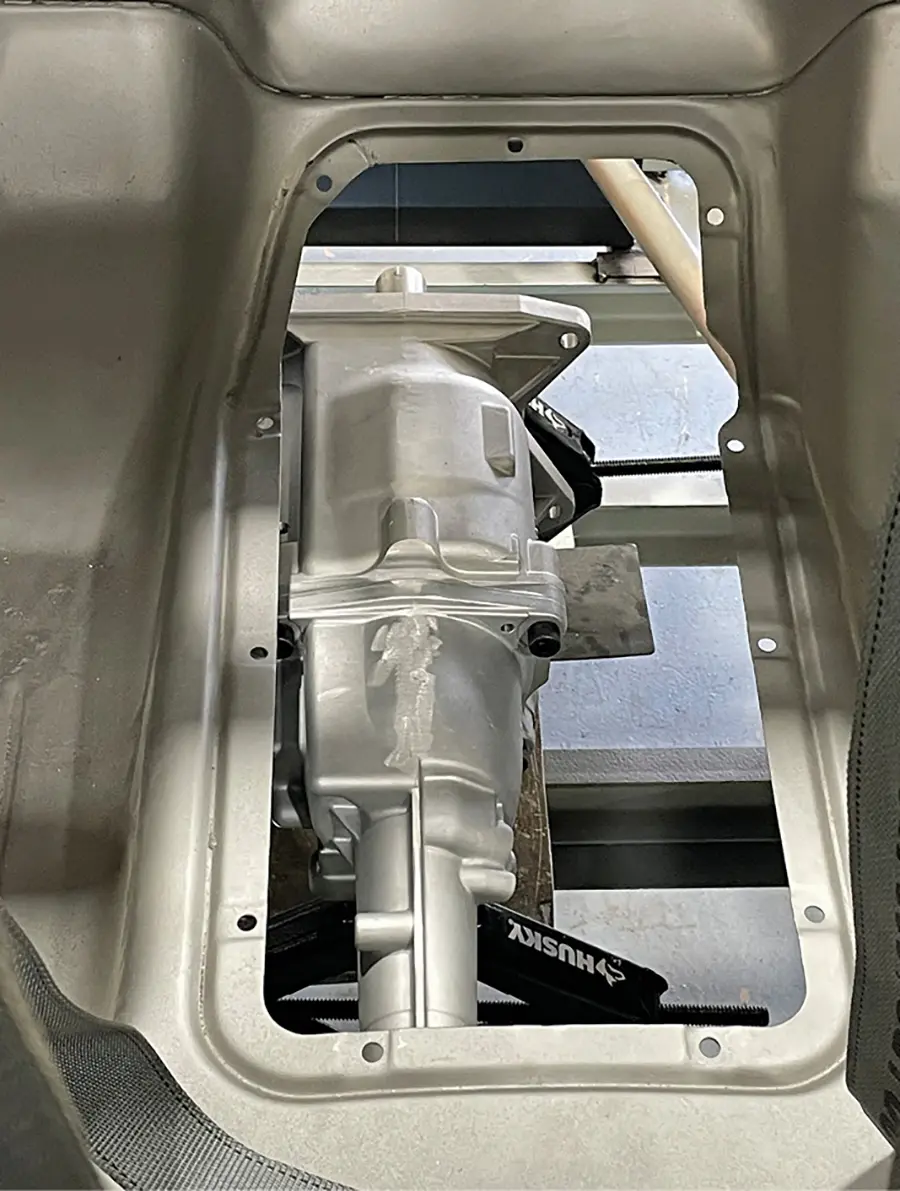 For some reason, Ford placed the transmission cover way off-center. Holm went to a lot of trouble to make this area symmetrical and to allow room for the scattershield.