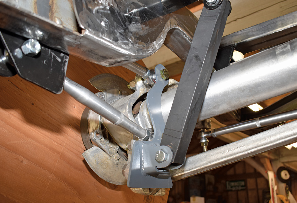 The coilover brackets serve double duty; they also mount the upper and lower control arms that located the hubs fore and aft.