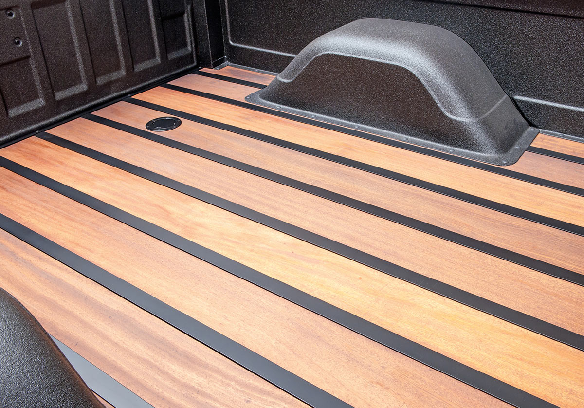 Custom wood floorboards in C10's bed