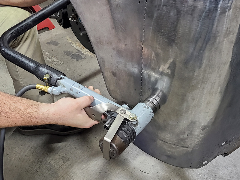  A hoop-type pneumatic planishing hammer also helps to flatten and shape the areas that need it.  