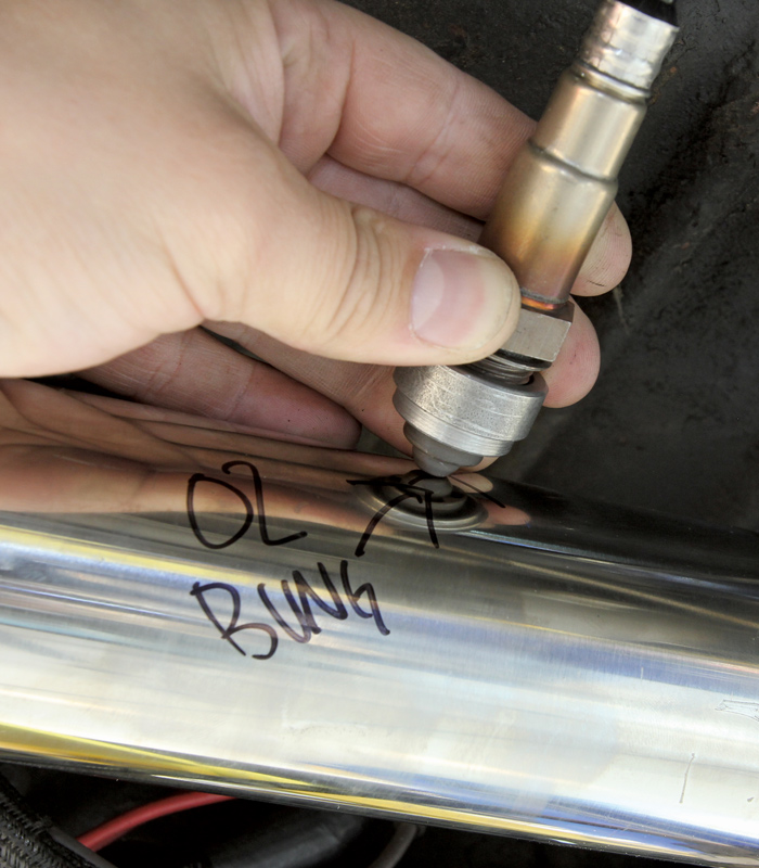 Bungs for O2 sensors are a necessity when an EFI system is being used and these can be tricky to install with everything in place. Best practices tells us to install the bung at the top section of the exhaust within 6-8 inches of the collector. Installing the bung at the top of the exhaust prevents moisture buildup from collecting on the sensor.