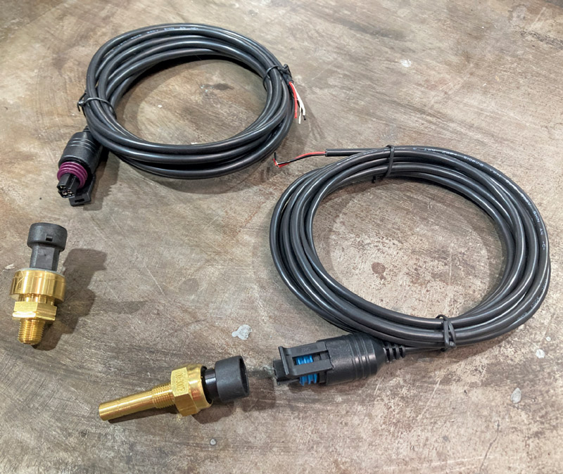 Solid state water temperature and oil pressure sensors provide accurate information continuously to the control box via custom cables.