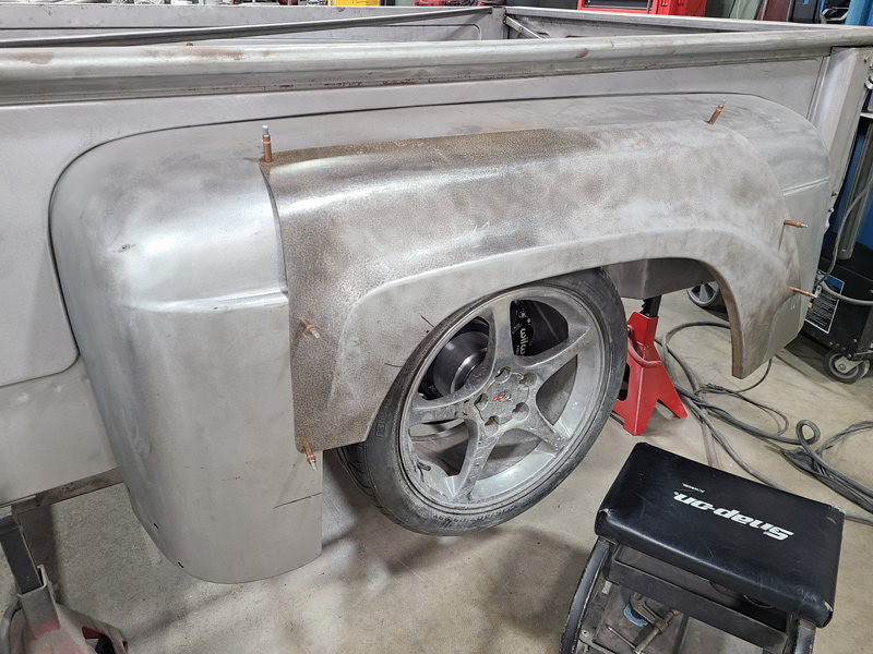  In a proof of concept, one of the spare front fenders was cut apart and Cleco’d to the existing fender to get a rough idea what the fender might end up looking like.