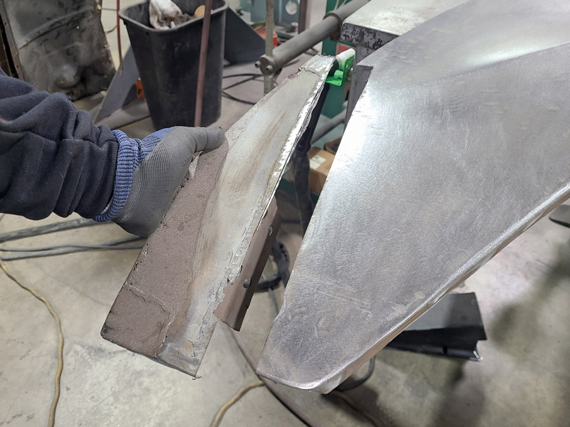 Some rust repair work was also needed, so Brandon Gerringer removed the old section and then formed a new piece before clamping and welding them together. The piece was intentionally left long as some areas of the fender’s new design were still being worked out.