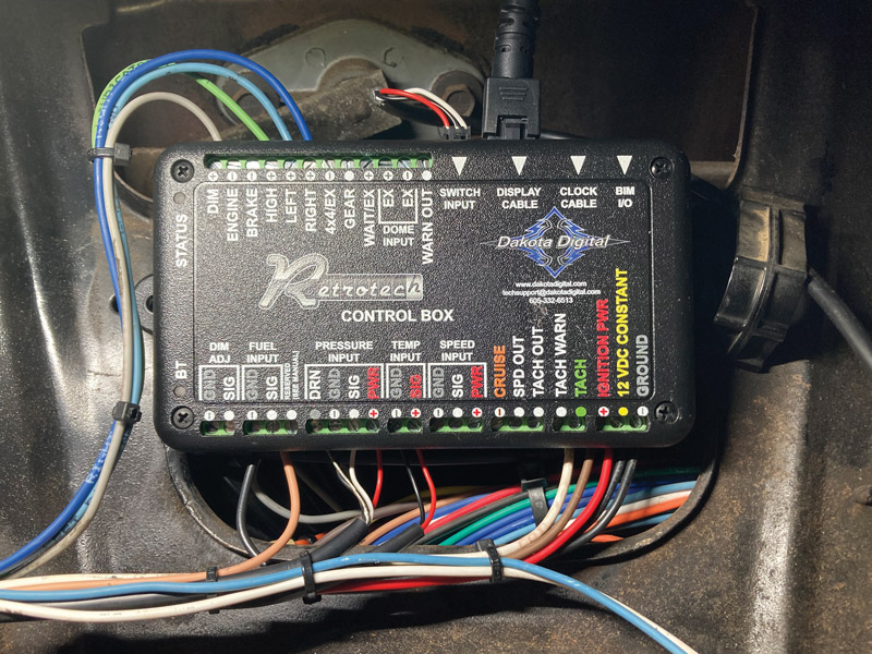 Additional connections made at the control box include 12V switched, battery, and ground; turn signal and high-beam inputs; tach and fuel level signals; and DIM, which connects to the taillight circuit to switch the instrument panel from day to nighttime setting when the headlights are switched on.