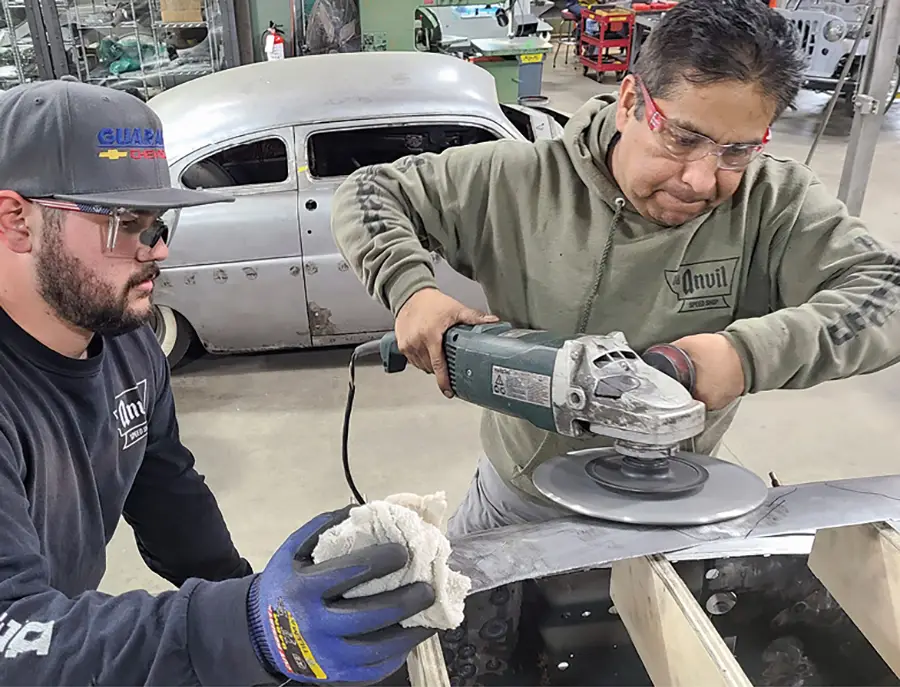 Once all perimeter pieces had been welded together and welds ground smooth, Saucedo shows Gerringer how quenching an area he’s working on with a shrinking disc will help the process move faster.