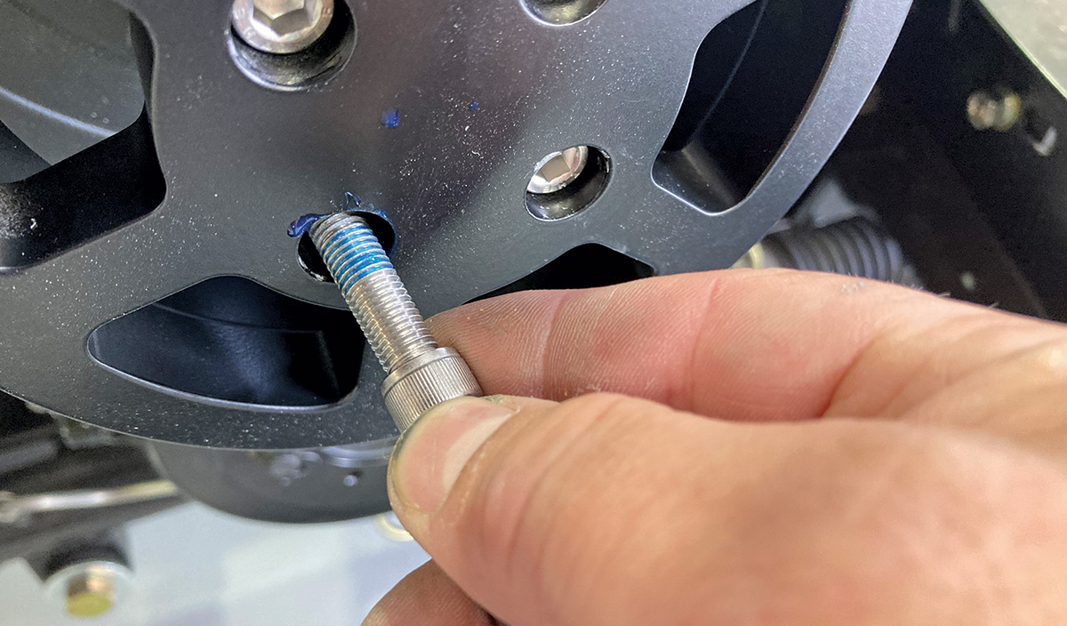 A dab of blue threadlocker on a capscrew