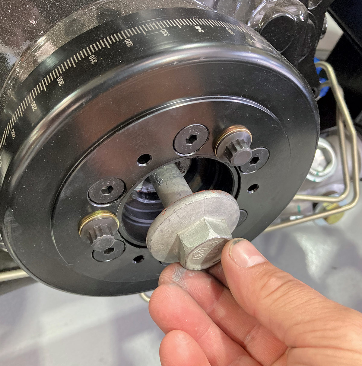 Close up of an OE GM crankshaft bolt being installed