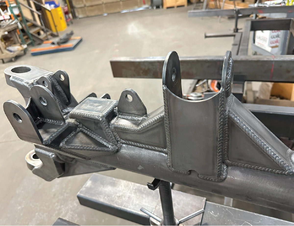 Like everything from AME, the new 4x4 axle housings are beautifully executed. The large bracket is for the upper three-link locator; other brackets are Panhard bar, coilover, and sway bar.