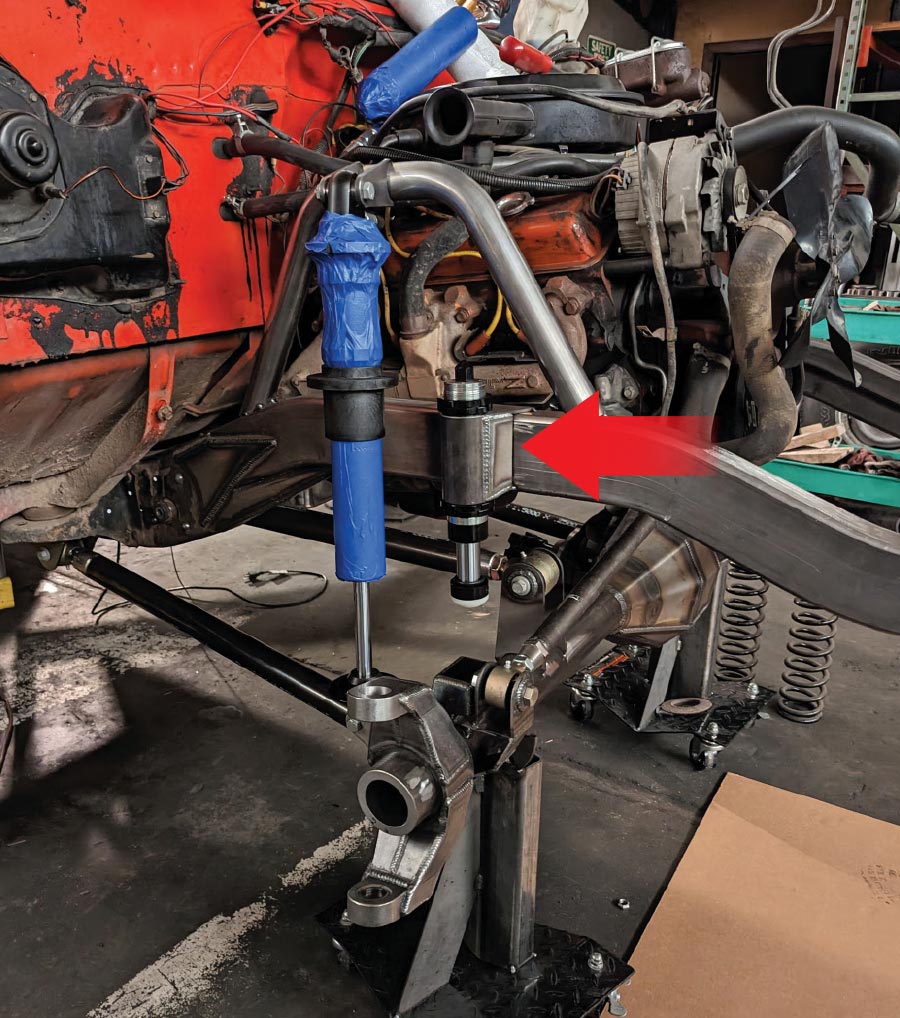 Front suspension includes coilover shocks, a Panhard bar, and hydraulic snubbers.