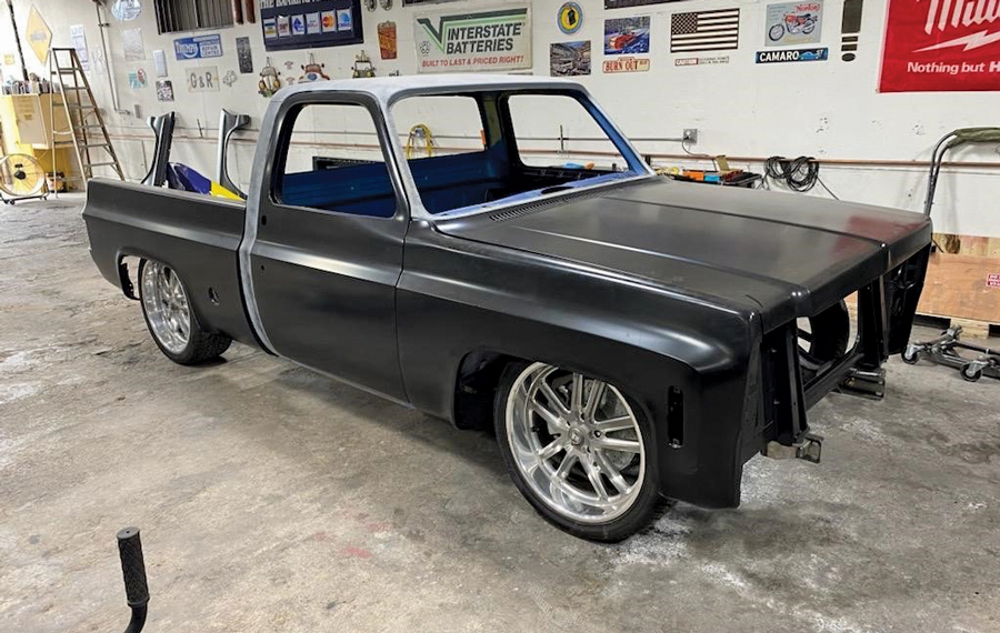 Black pickup truck with blue interior