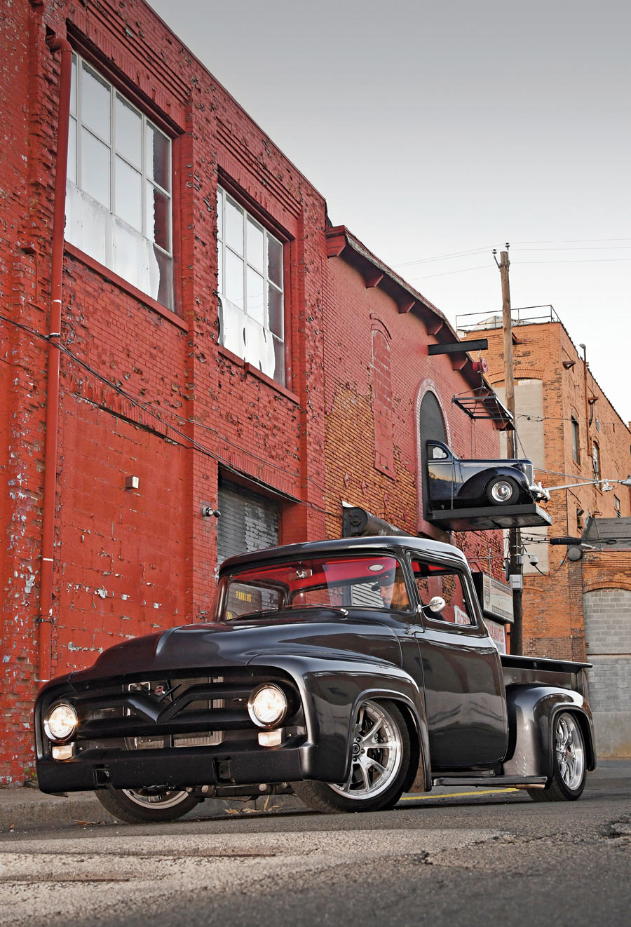 '56 F-100 in front of old red brick building
