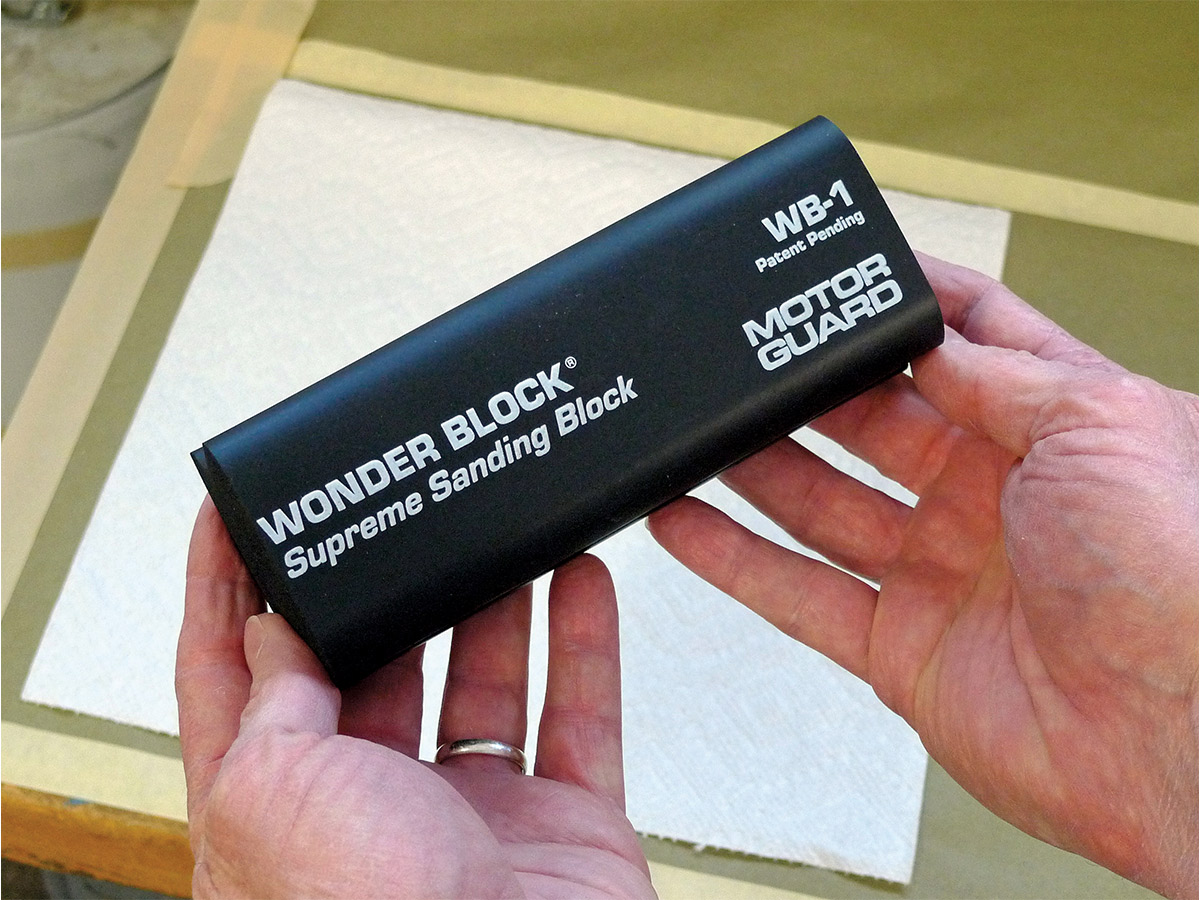 Hands holding a brand-new Motor Guard WB-1