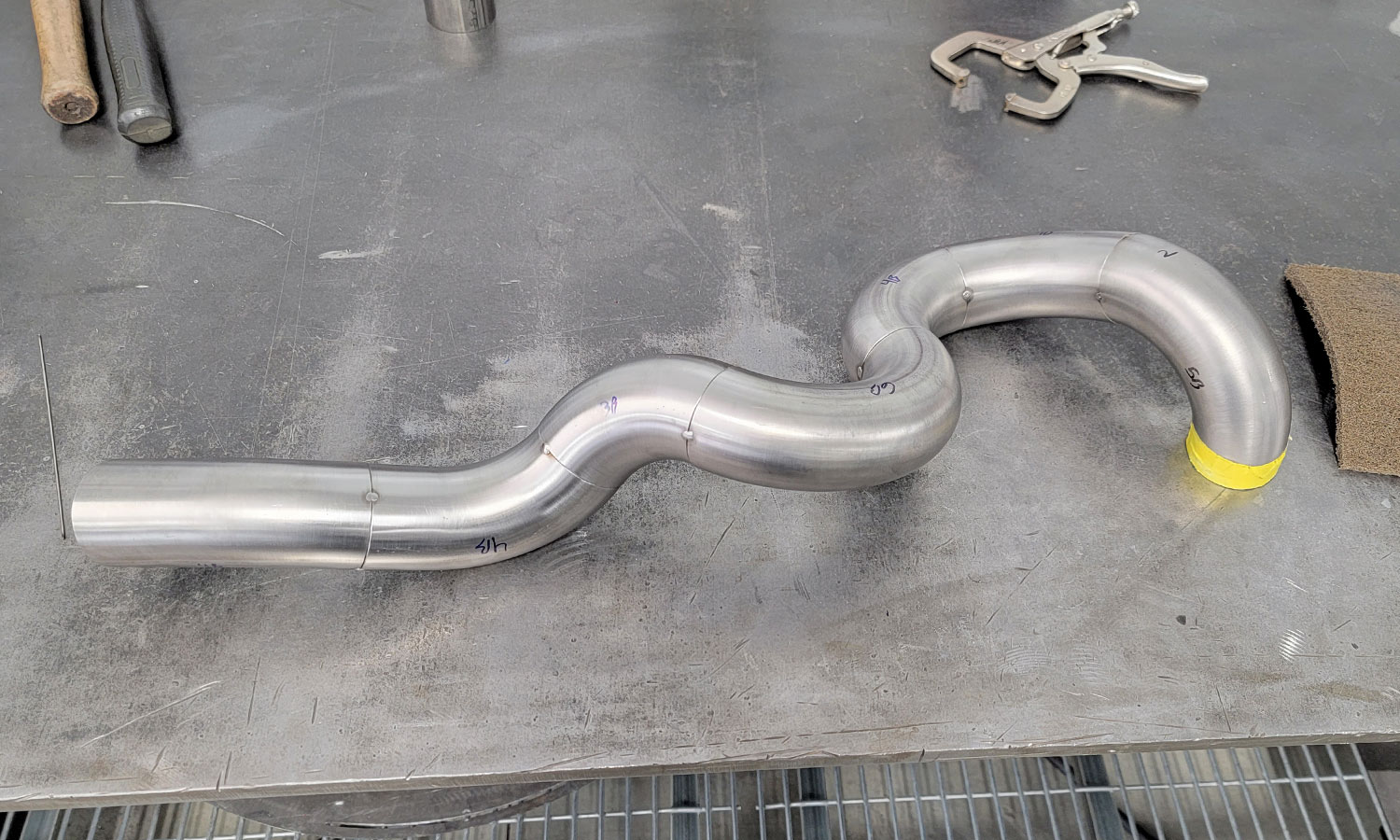 Header tube laying on table