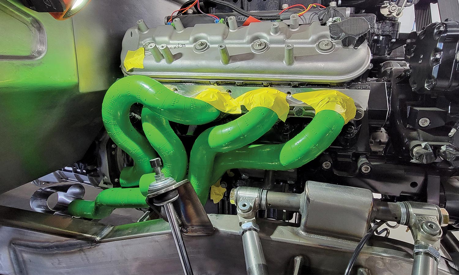 Close up of header installation with green and yellow tape