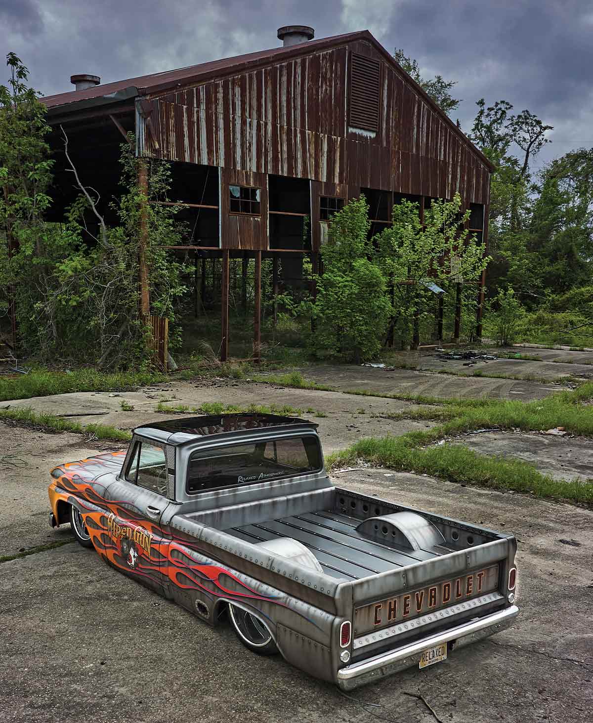 '66 Chevy C10 3/4 rear view in front of abandoned building