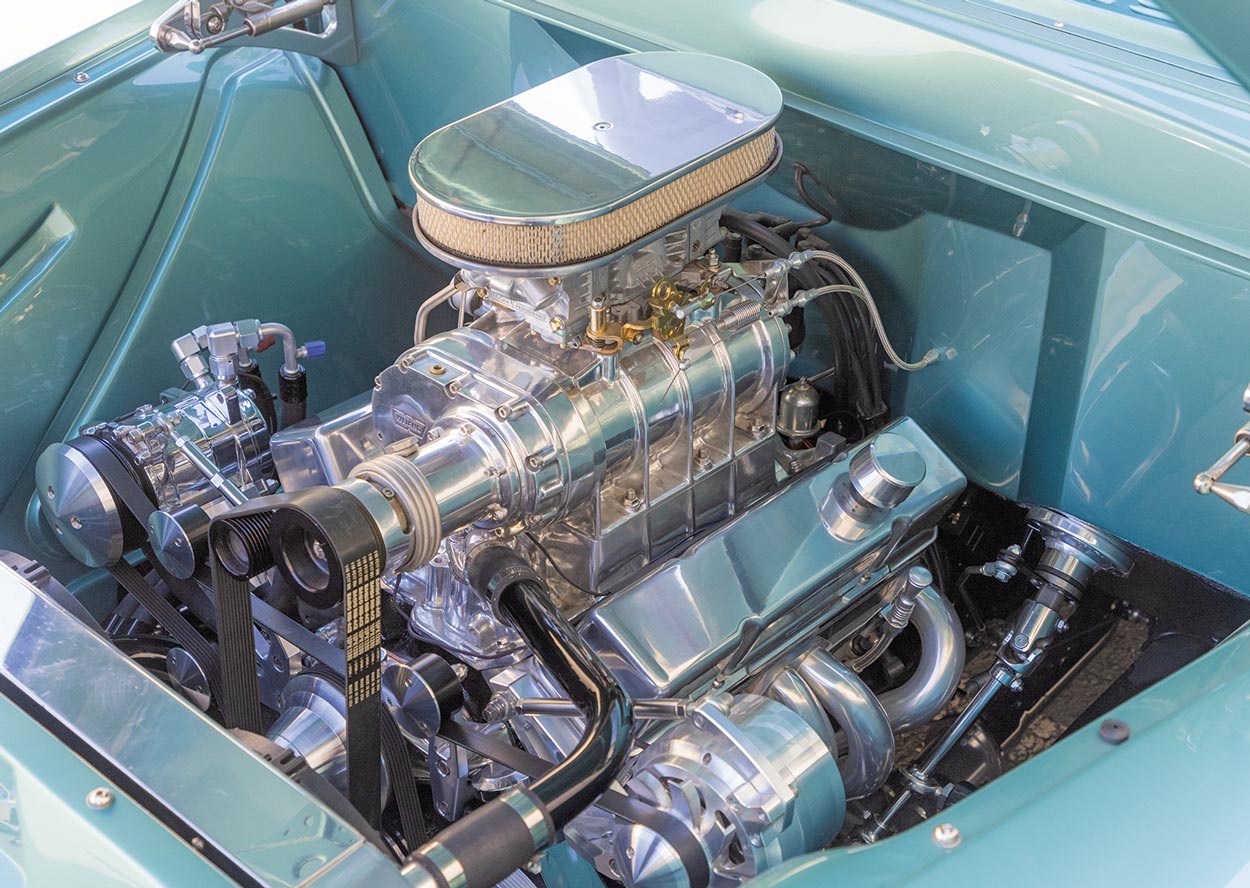 the sea green ’56 Chevy truck's engine