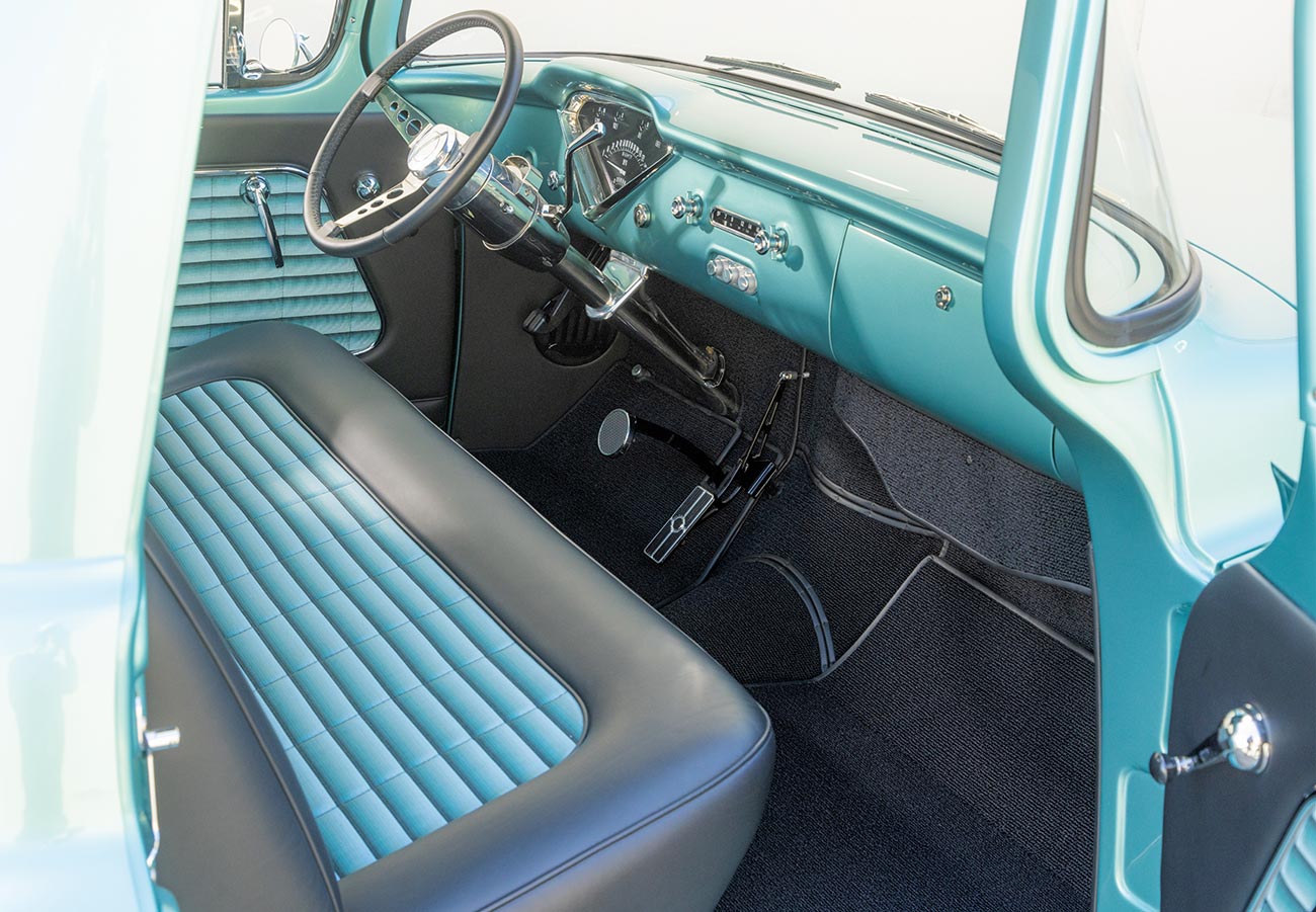 wider view from the open passenger side door inside the cab of the sea green ’56 Chevy truck 