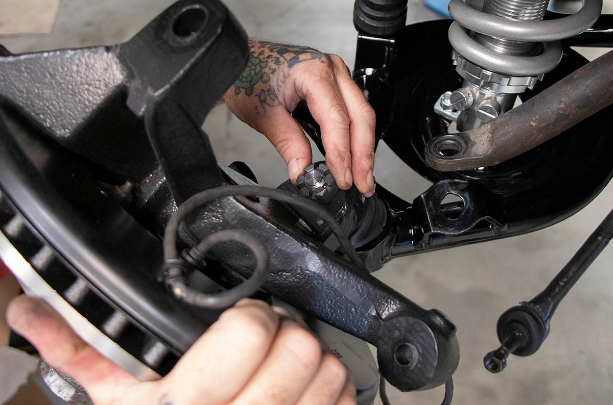 The stock spindle and brake assemblies are attached to the new lower ball joint that comes installed in the control arms.