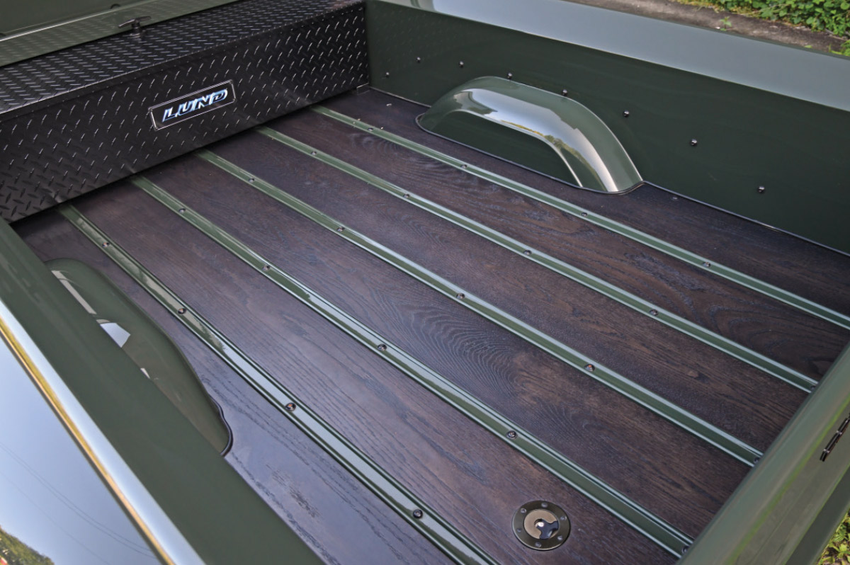 Wood finished bed of Dark green ’54 F-100 pickup truck