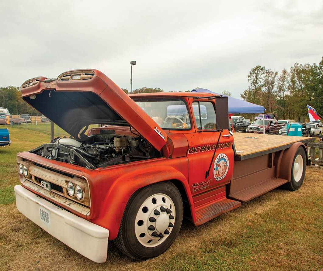 red C10 truck with hood propped open