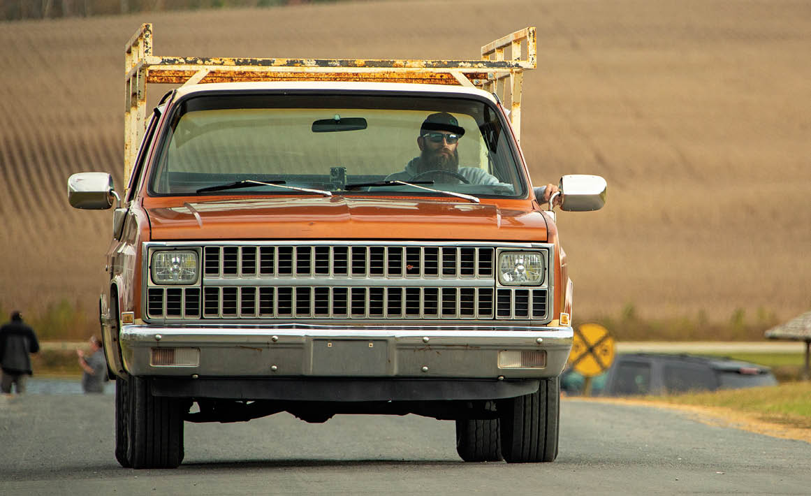 front of an orange C10 truck