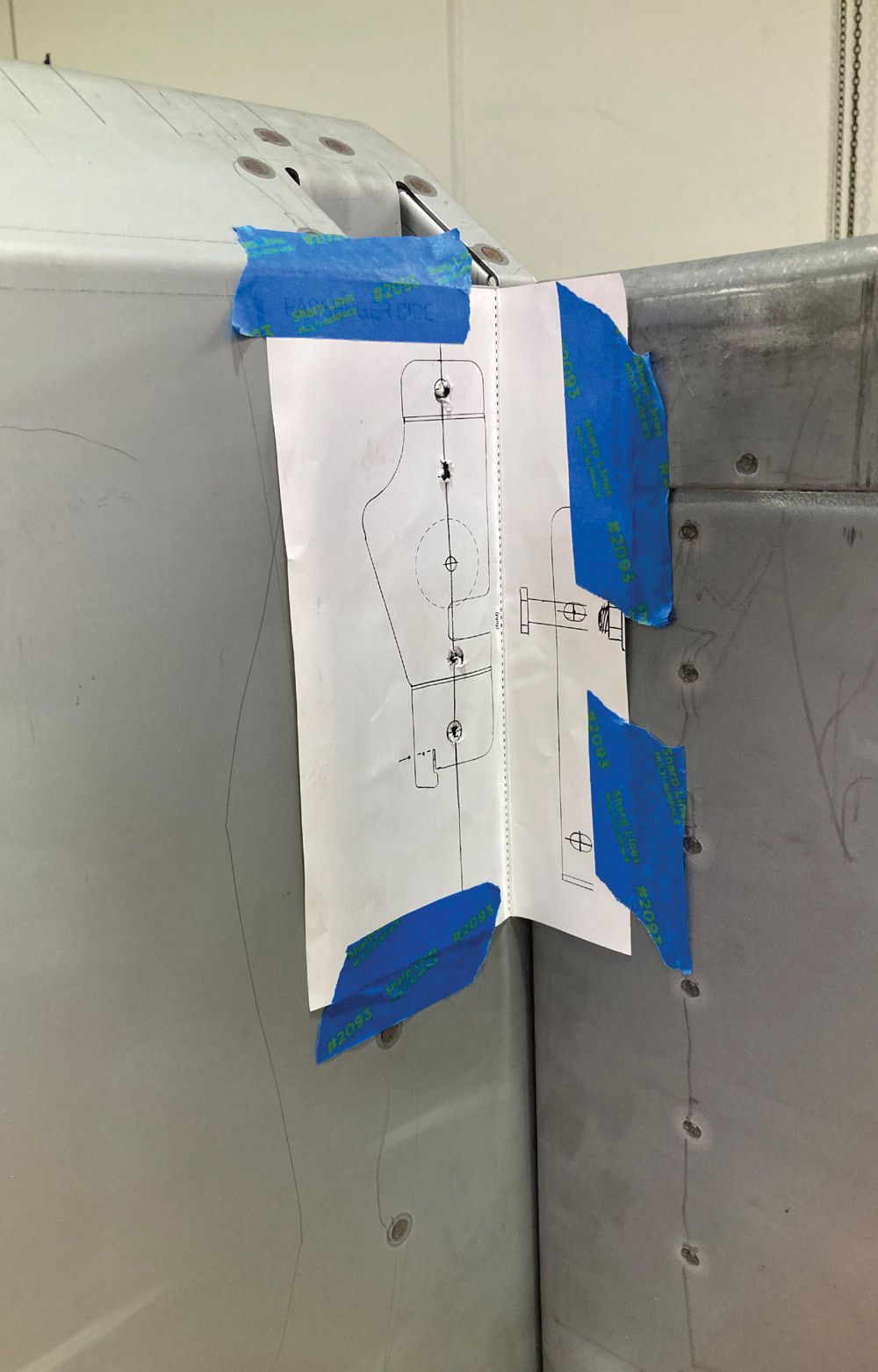 template taped to know where to drill holes