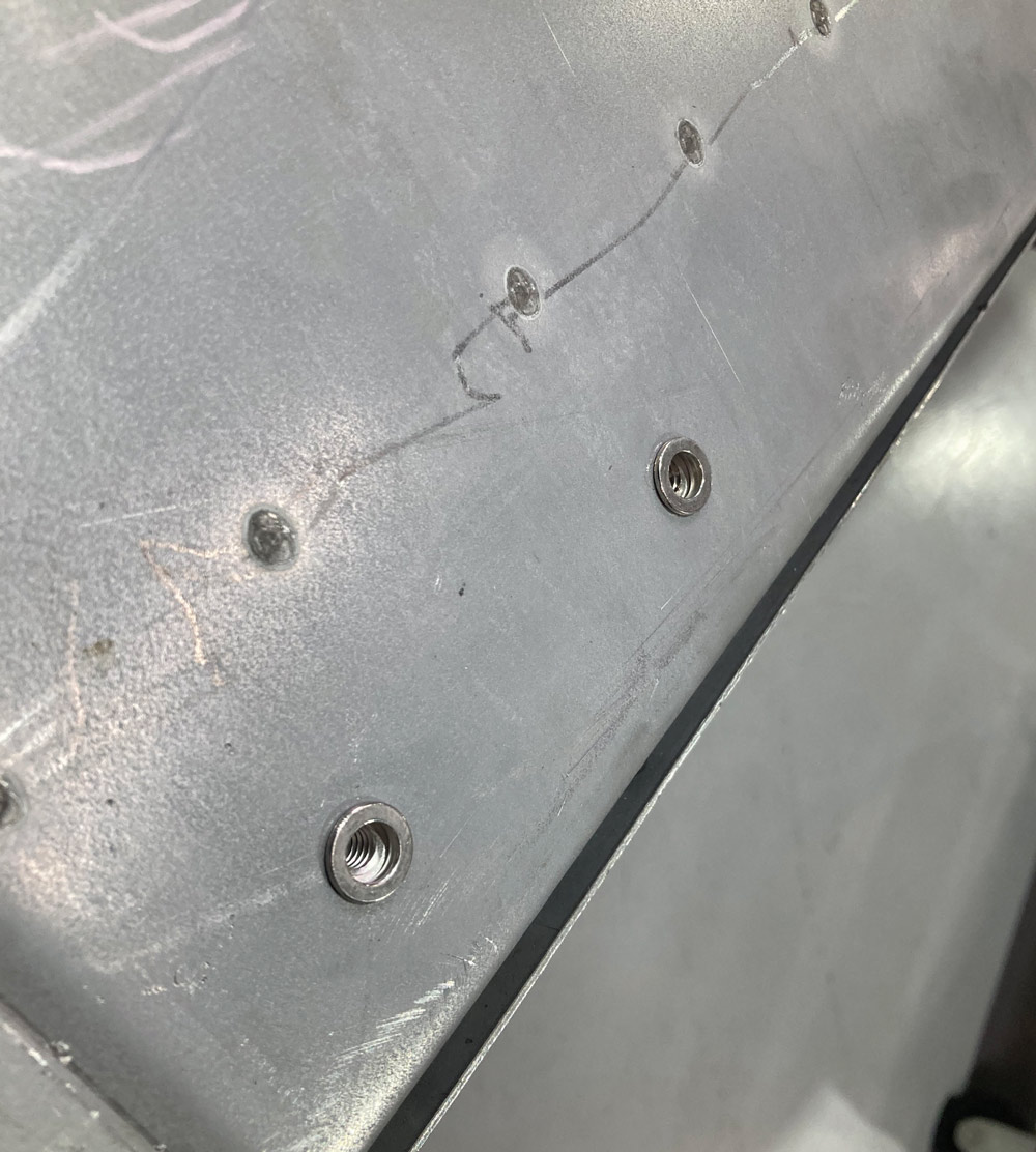 screw hole in a piece of sheet metal