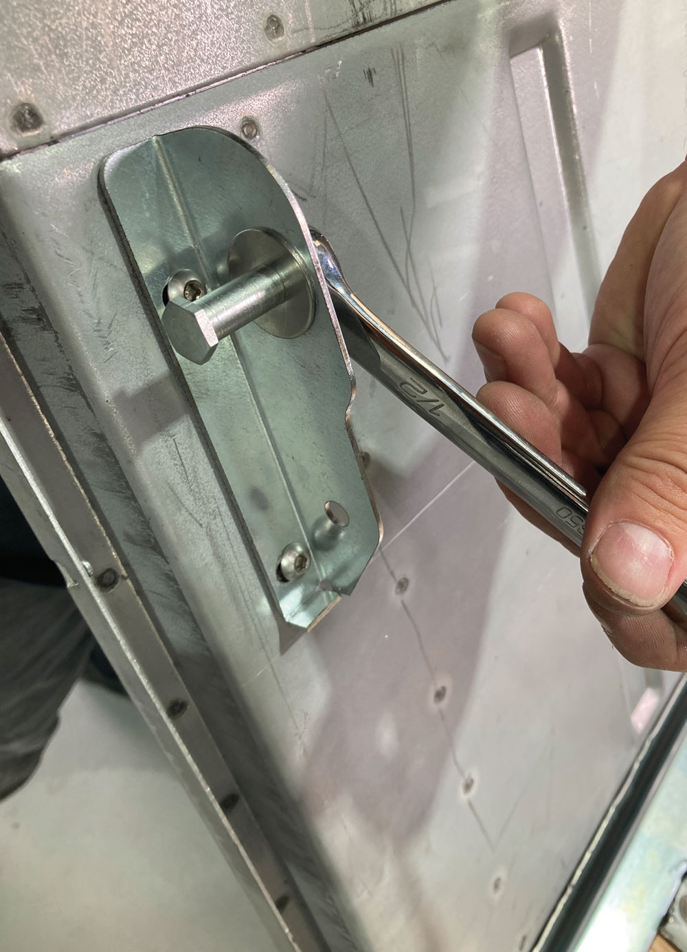 latch pin being screwed into place