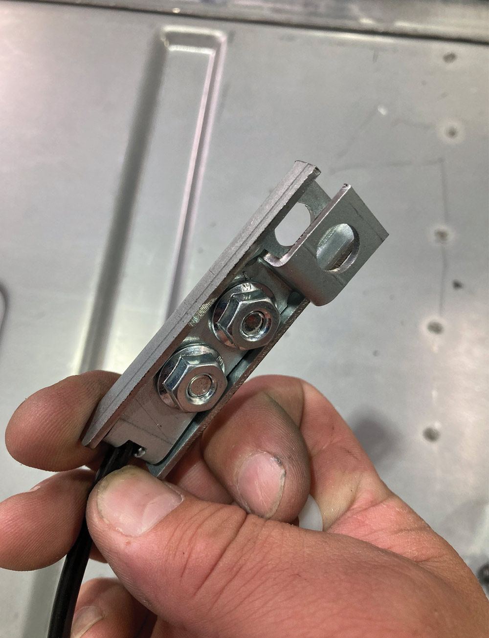 support cable being inserted into bracket