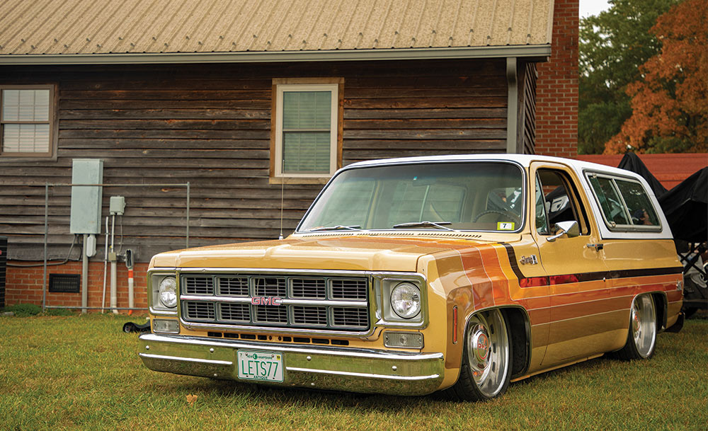 3/4 view of orange and yellow C10 truck