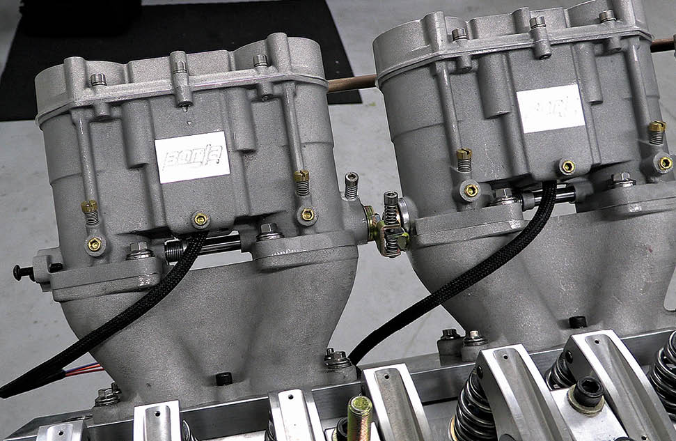 On the intake side, Dorton is using six Borla throttle bodies designed to look like old-school Weber carbs. Except these are kitted with fuel injection. They mount onto custom bases that funnel the air into the intake ports.