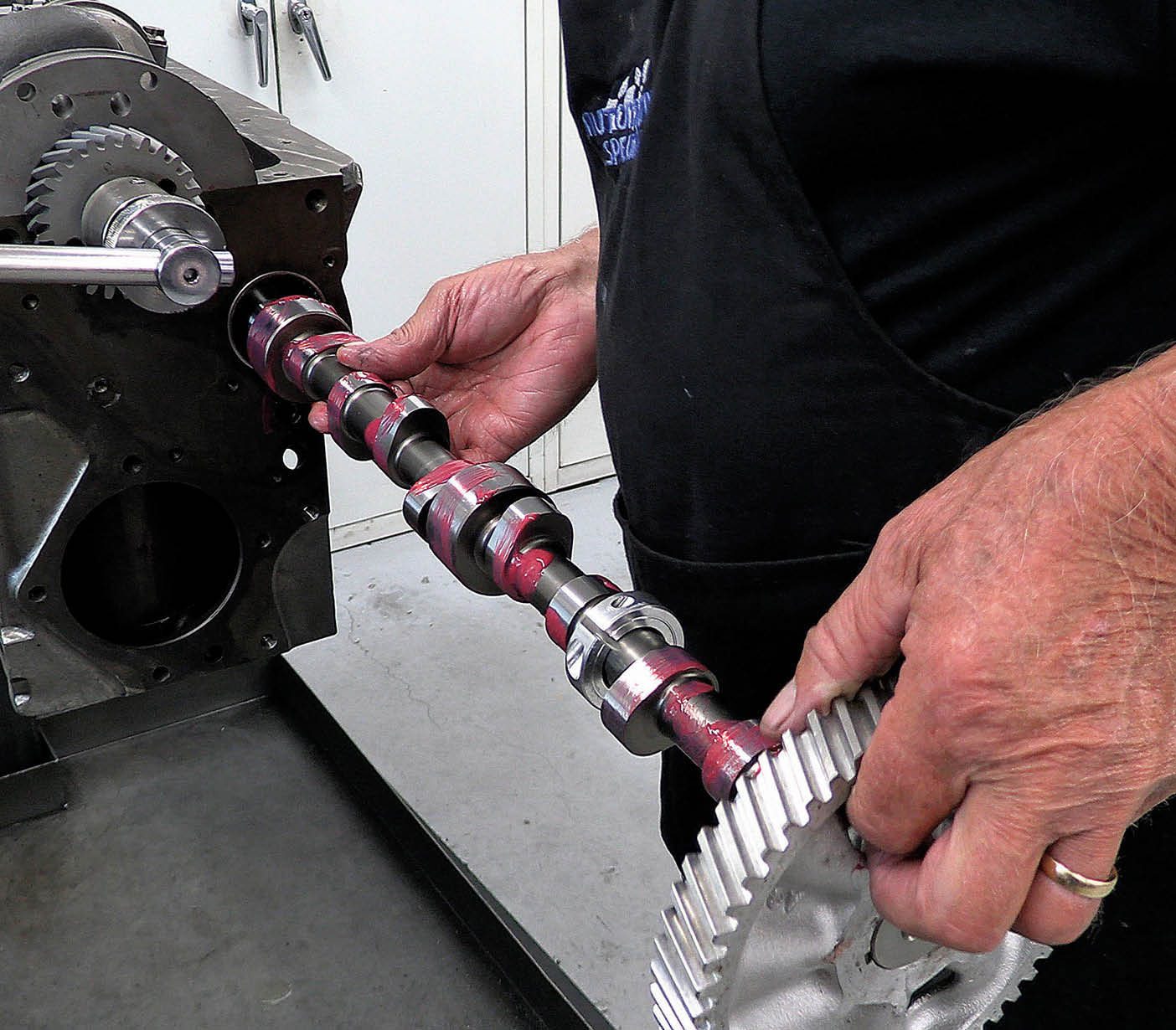 There was no way he was going to be able to find a cam to meet his specs. After all, the second-generation straight-six never came with a roller cam, which we wanted to use. So Dorton honed the cam bores out to accept a 50mm cam and then installed high-performance needle bearings. Then he had a custom cam ground from billet steel. This is a solid roller cam with 250 degrees of duration at 0.050 tappet lift for both the intakes and exhausts. Lobe lift is 0.374 inch, and with a 1.74 ratio rocker arm, total valve lift will be 0.550 inch. Notice the collar clamped to the shaft of the cam just behind the cam gear at the front. That’s for the cam timing sensor, which we’ll explain in more detail. Also, there is no cam gear here, so an external oil pump will need to be employed.
