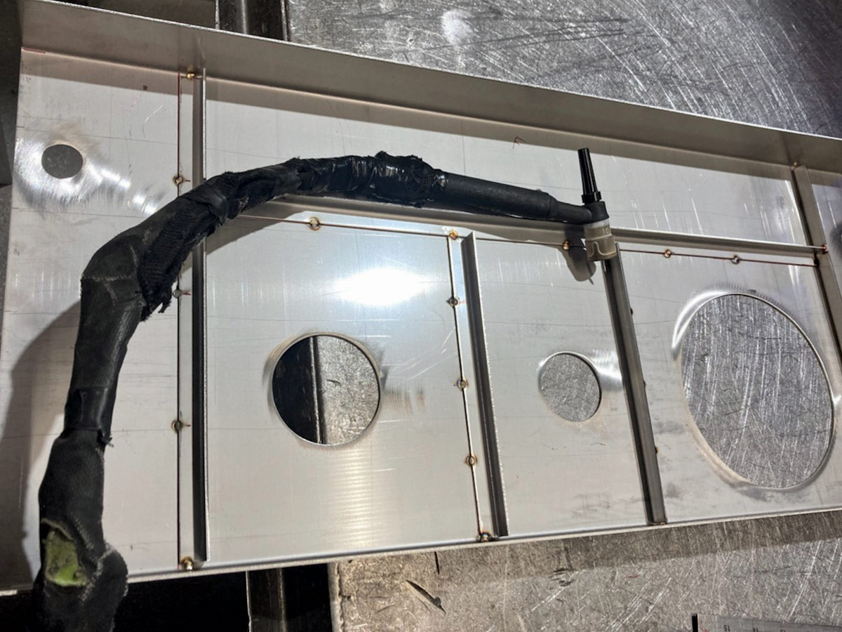 The top panel of the tank receives substantial bracing to add strength and rigidity to the assembly before the mounts for the sending unit, filler, and pump module are tacked in place.