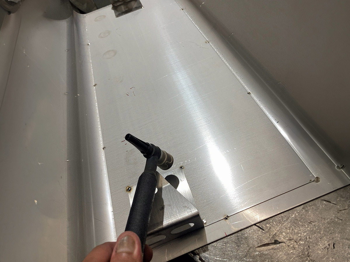 Back to the bottom section, a second stainless panel is welded to the bottom of the tank, adding strength and providing a secure mount for the side panel brackets and a mount location for the pump module. This is also an important part of the final, clean, weld-free appearance underneath.