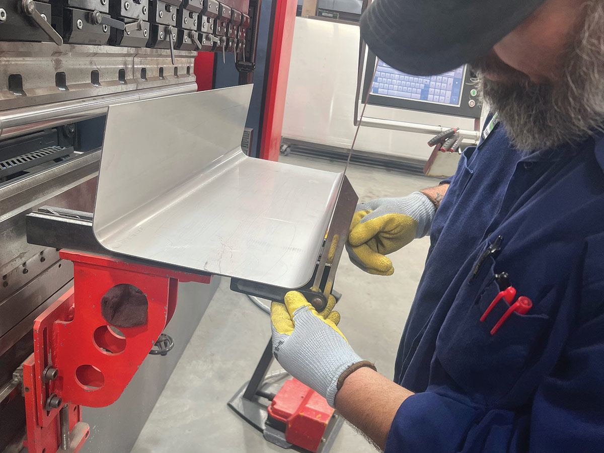The larger bottom section of the tank was formed on a CNC press/brake. Measurements are constantly checked and confirmed through the hand-formed process.