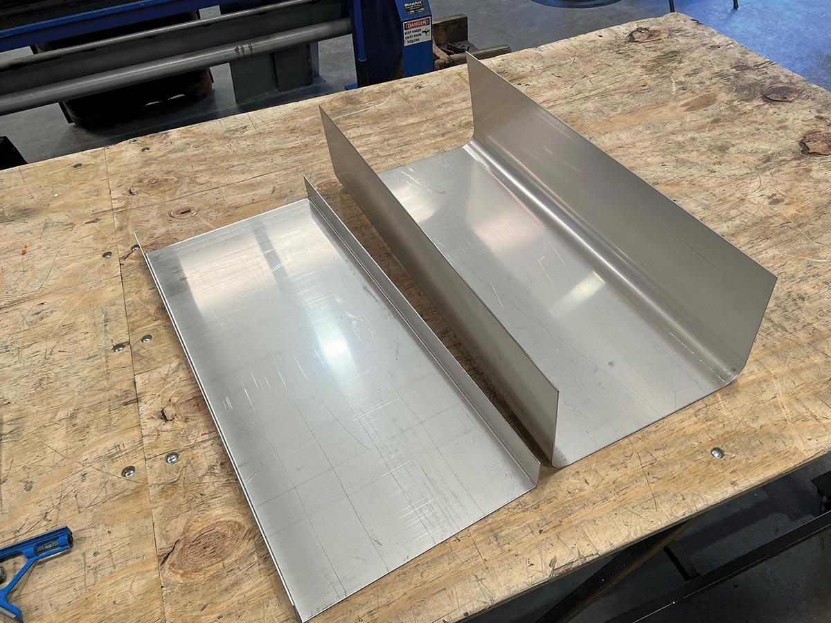 The top and bottom portions of the tank are trimmed and prepped for TIG welding assembly. 