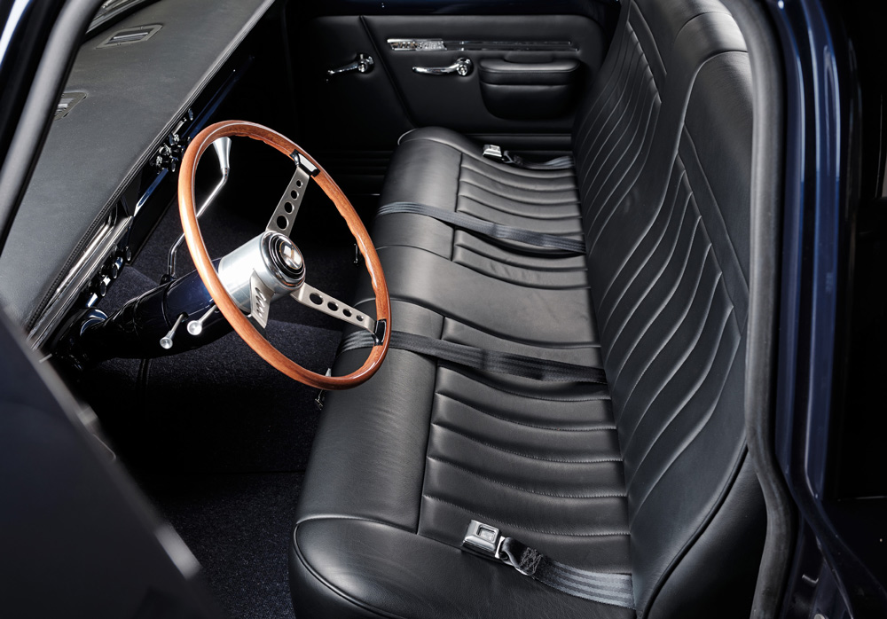 steering wheel and black leather interior in a ’67 Ford F-100