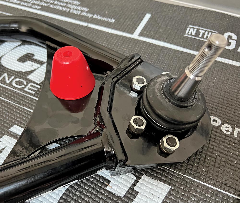 close view of a lower A-arm with a ball joints already installed