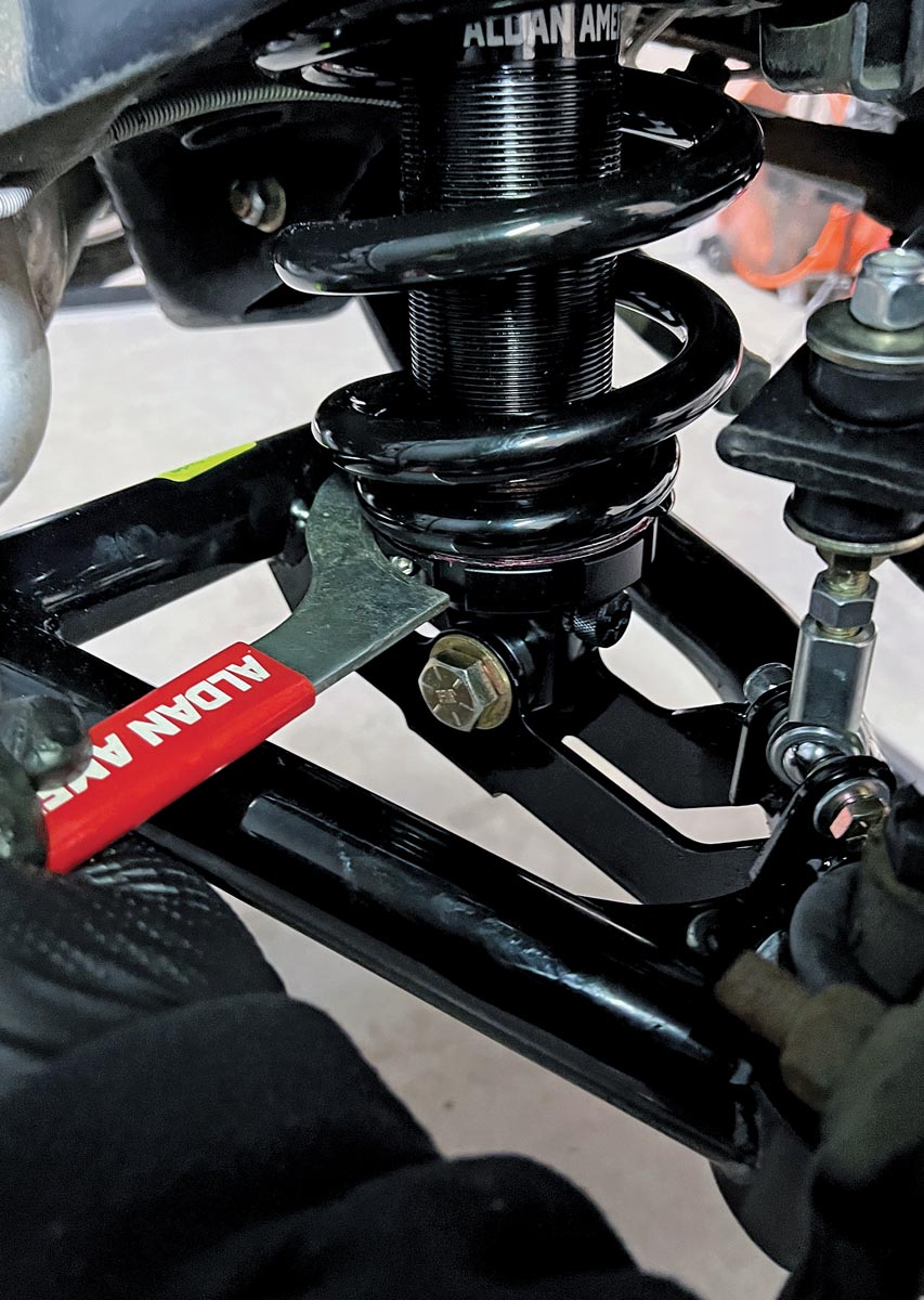 the Aldan American kit provided wrench is used to make an adjustment to the lower spring mount